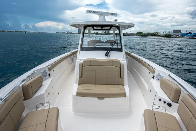 Southern Pass Yacht Photos Pics 2019 Pursuit S 328 Sport boat with beige seating on open water.