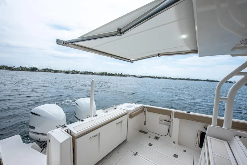 Southern Pass Yacht Photos Pics 2019 Pursuit S 328 Sport boat with dual Yamaha engines on open water.