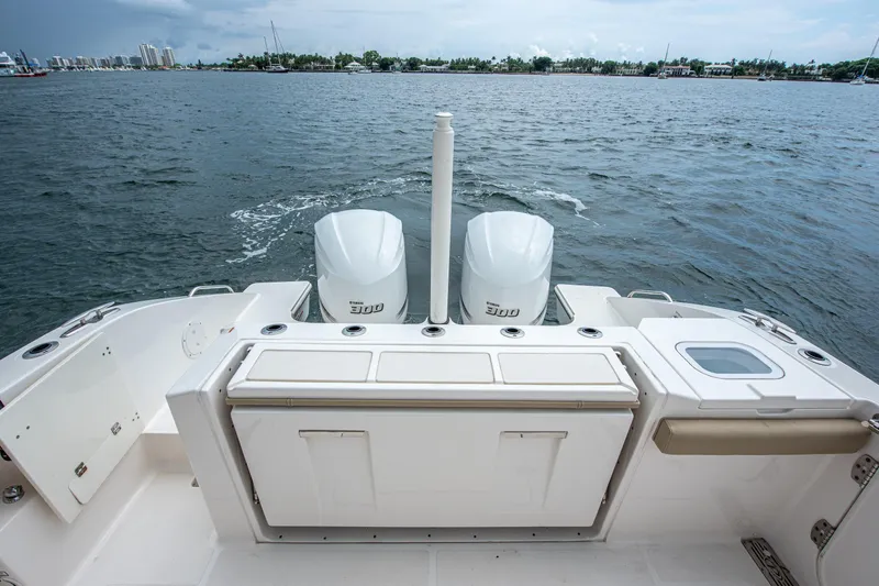 Southern Pass Yacht Photos Pics 2019 Pursuit S 328 Sport boat with dual engines on open water.