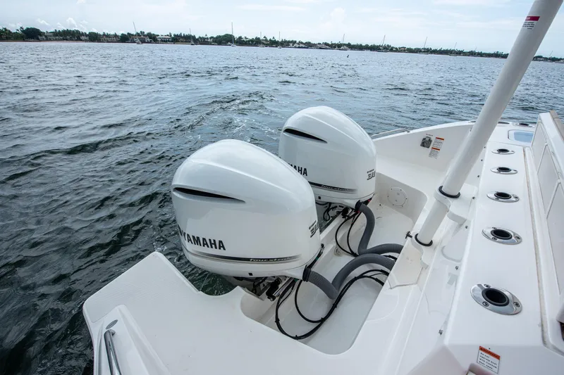 Southern Pass Yacht Photos Pics 2019 Pursuit S 328 Sport boat with dual Yamaha outboard engines on water.
