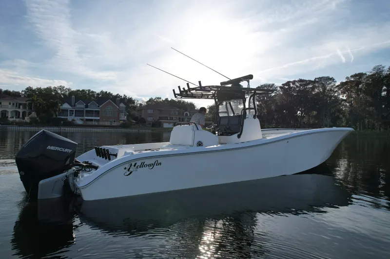  Yacht Photos Pics 2009 Yellowfin 36 Offshore boat on calm water, with Mercury engine, under a clear sky.