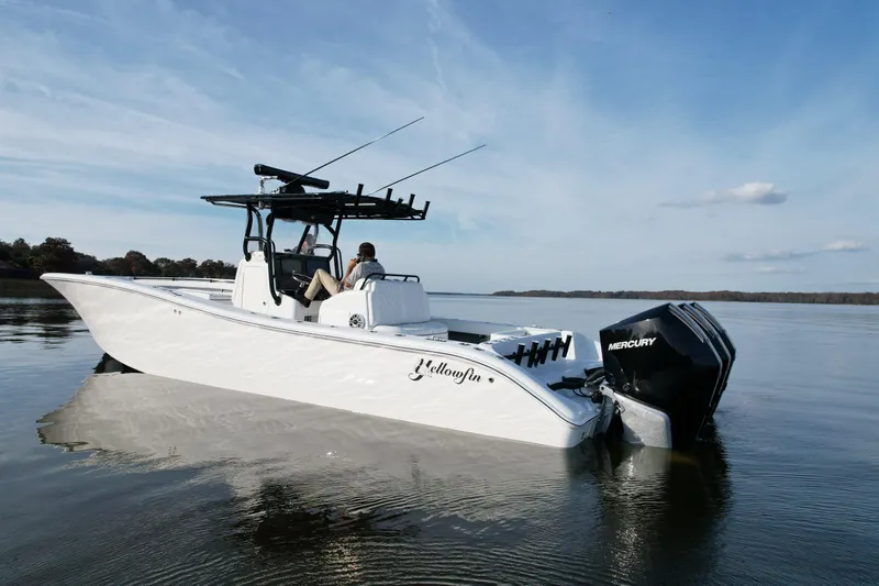  Yacht Photos Pics 2009 Yellowfin 36 Offshore boat on calm water, featuring Mercury engines.