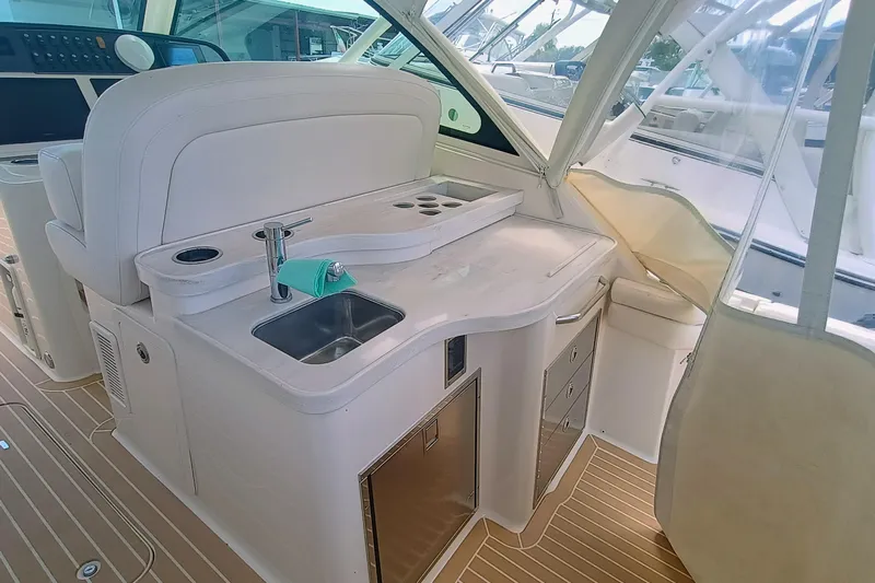 375-712 Used Yacht Photos Pics 2021 Grady-White Freedom 375 boat interior with sink, storage, and seating area.