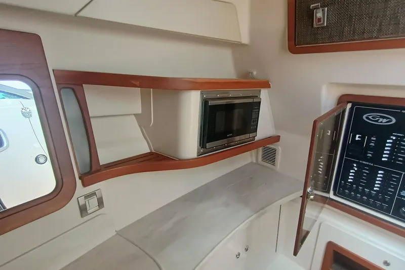 375-712 Used Yacht Photos Pics 2021 Grady-White Freedom 375 interior with microwave and control panel.
