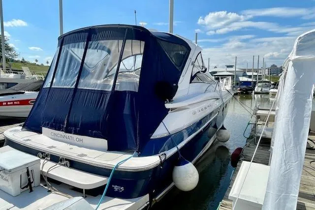 "just One Mohr" Yacht Photos Pics 2005 Regal Commodore 4260 yacht docked in Cincinnati marina under clear blue sky.