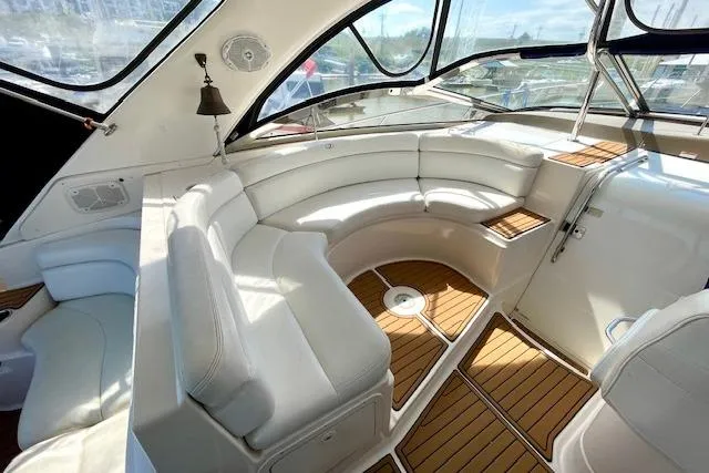 "just One Mohr" Yacht Photos Pics Luxurious 2005 Regal Commodore 4260 yacht interior with white leather seating and wood flooring.