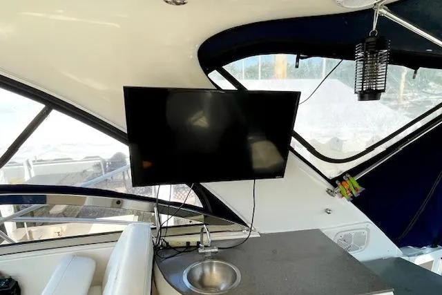 "just One Mohr" Yacht Photos Pics Interior of 2005 Regal Commodore 4260 yacht with TV and sink.