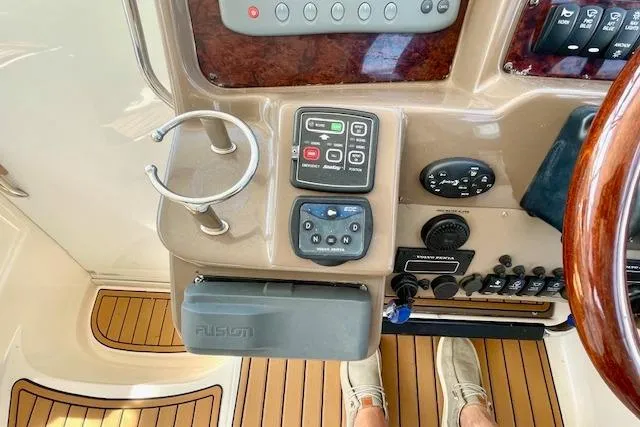 "just One Mohr" Yacht Photos Pics Control panel of 2005 Regal Commodore 4260 yacht with wooden flooring and electronic controls.