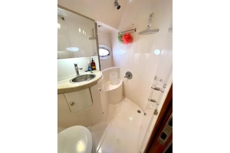 "just One Mohr" Yacht Photos Pics Bathroom interior of 2005 Regal Commodore 4260 yacht, featuring sink and shower.