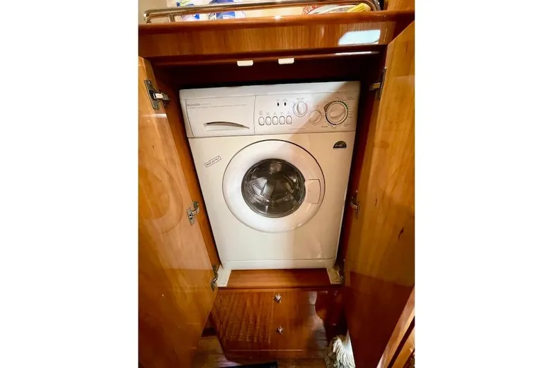 "just One Mohr" Yacht Photos Pics Built-in washing machine inside a 2005 Regal Commodore 4260 wooden cabinet.