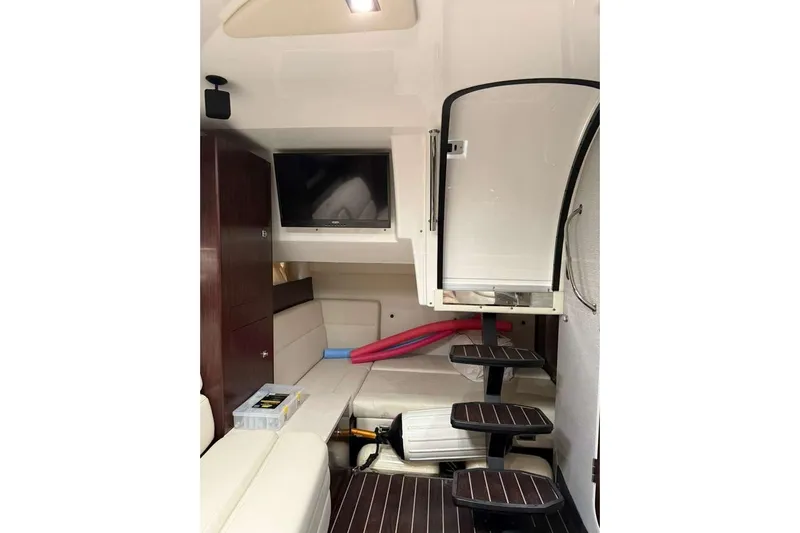  Yacht Photos Pics Interior of 2018 Monterey 335 Sport Yacht with TV, seating, and stairs.
