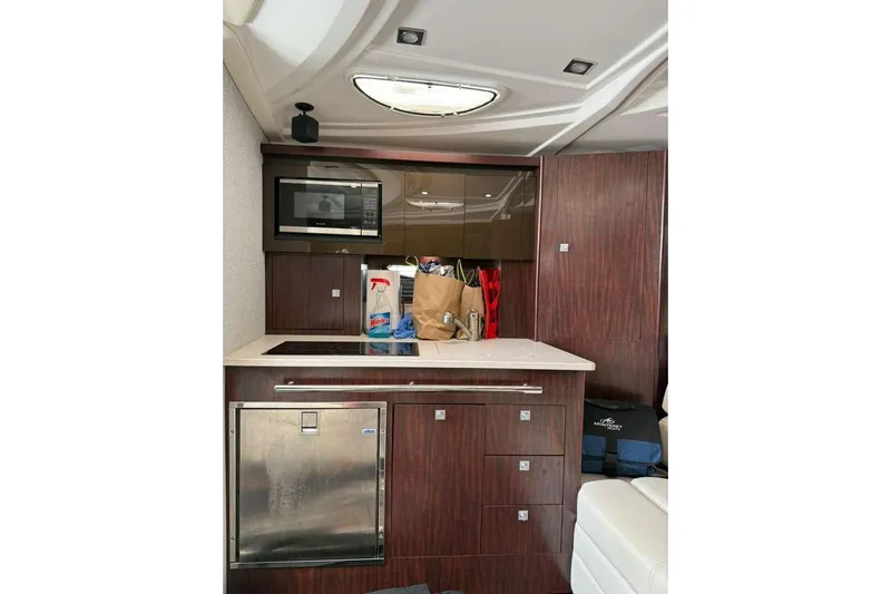  Yacht Photos Pics Interior of 2018 Monterey 335 Sport Yacht with kitchenette and modern amenities.