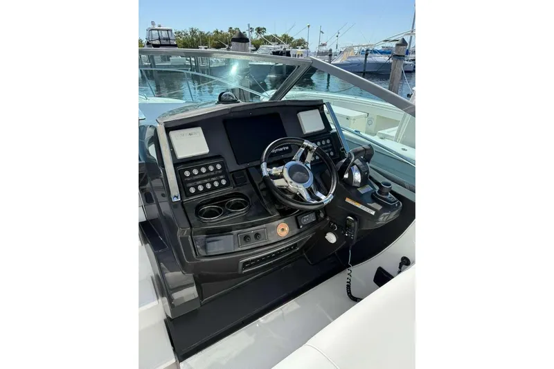  Yacht Photos Pics 2018 Monterey 335 Sport Yacht helm with modern controls and navigation system.