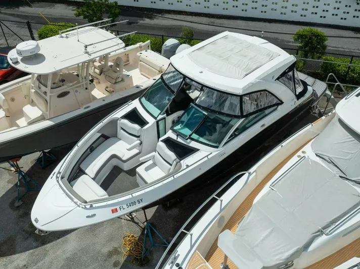  Yacht Photos Pics 2020 Four Winns H350 boat docked, featuring sleek design and spacious seating.