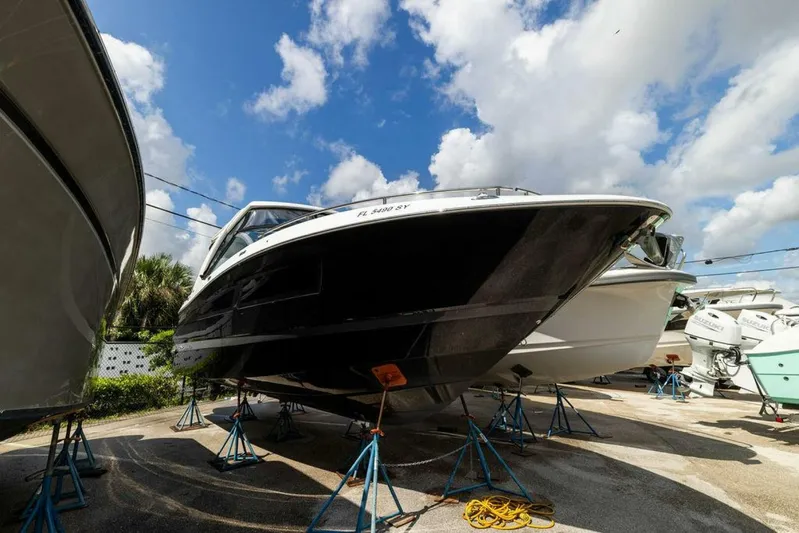  Yacht Photos Pics 2020 Four Winns H350 boat on stands under a blue sky.