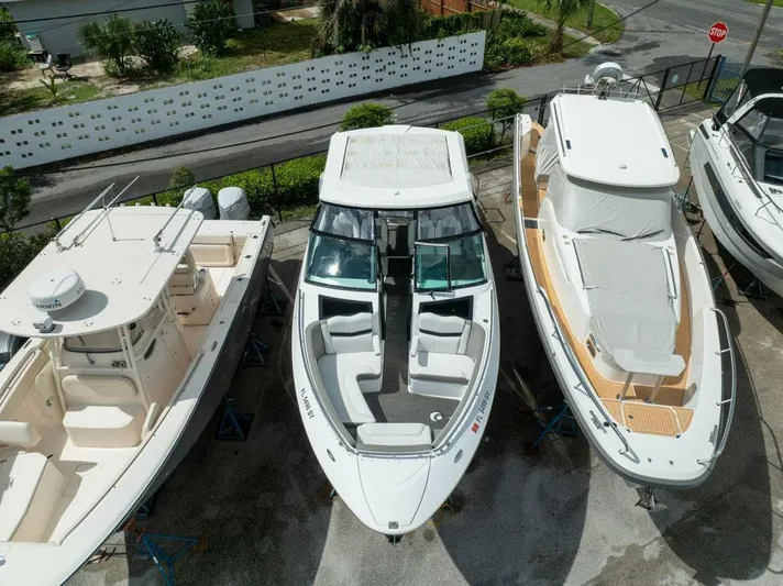  Yacht Photos Pics 2020 Four Winns H350 boat docked among other vessels, aerial view.