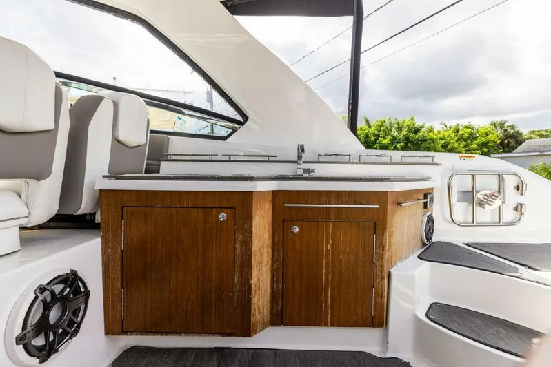  Yacht Photos Pics 2020 Four Winns H350 boat interior with wooden cabinetry and seating.