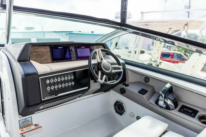  Yacht Photos Pics 2020 Four Winns H350 boat cockpit with modern controls and steering wheel.