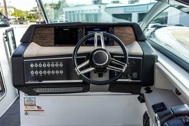  Yacht Photos Pics 2020 Four Winns H350 boat dashboard with steering wheel and control panel.