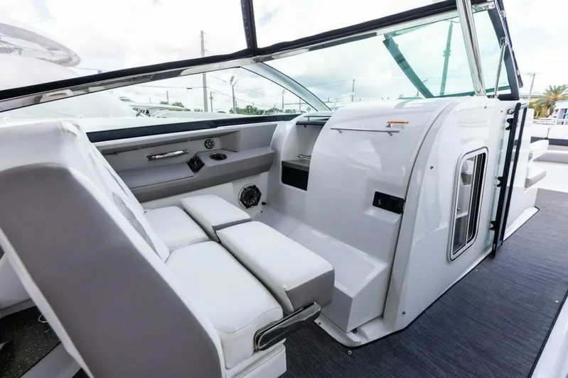  Yacht Photos Pics 2020 Four Winns H350 boat interior with white seating and modern dashboard.