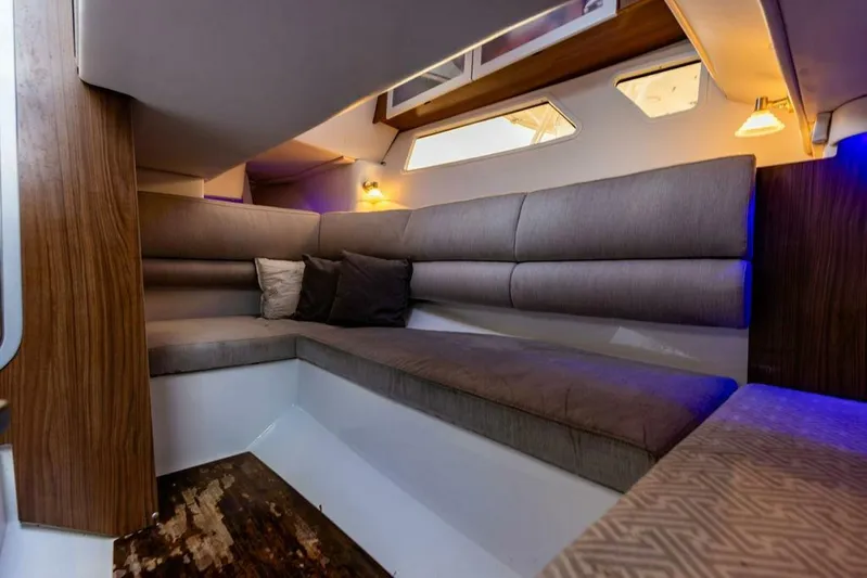  Yacht Photos Pics Luxurious interior of 2020 Four Winns H350 boat with plush seating and ambient lighting.
