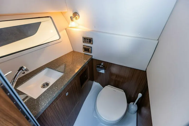  Yacht Photos Pics Luxurious 2020 Four Winns H350 yacht bathroom with modern fixtures and elegant design.