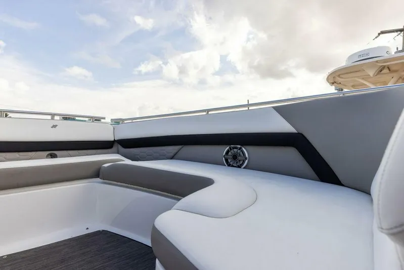  Yacht Photos Pics 2020 Four Winns H350 boat interior with cushioned seating and speaker.