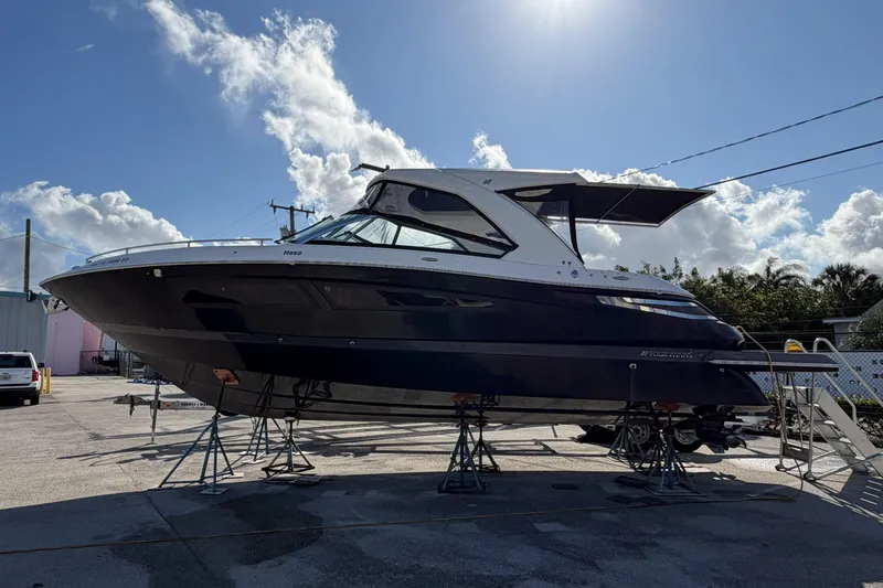  Yacht Photos Pics 2020 Four Winns H350 boat on stands under a clear blue sky.