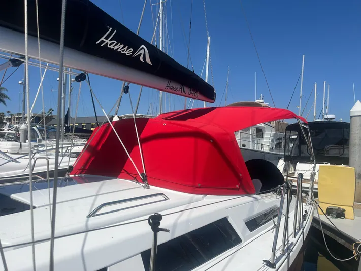 348 Sea Yacht Photos Pics 2026 Hanse 348 sailboat with red canopy docked at marina.
