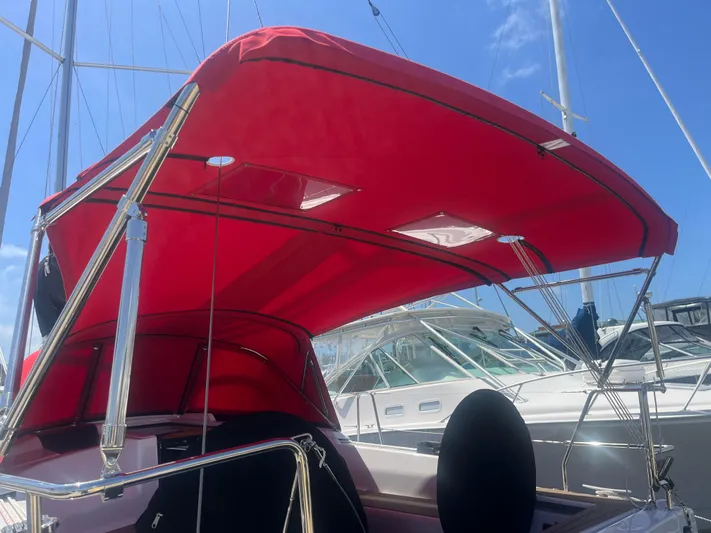 348 Sea Yacht Photos Pics Red canopy on a 2026 Hanse 348 sailboat under a clear blue sky.