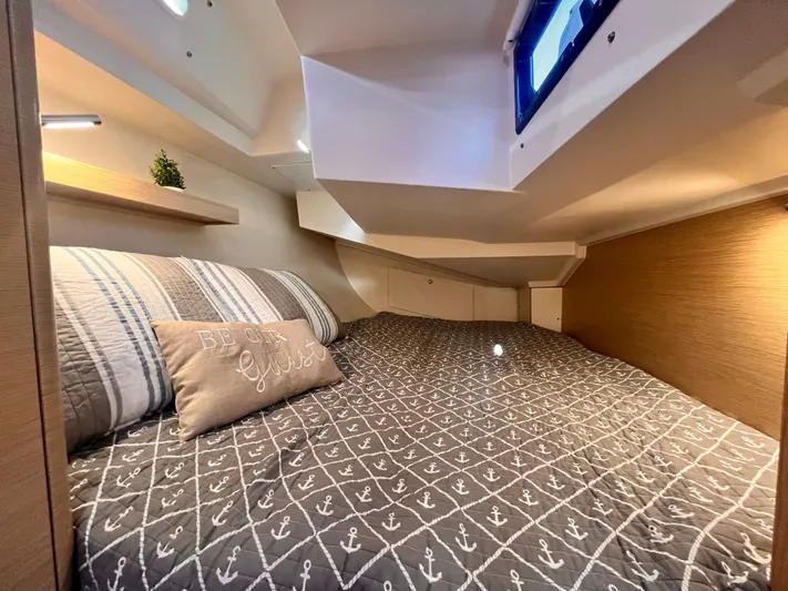 348 Sea Yacht Photos Pics Cozy cabin interior of 2026 Hanse 348 yacht with nautical-themed bedding.