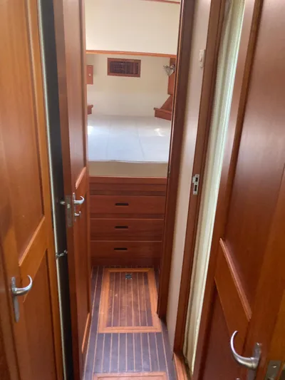 Tatosh Yacht Photos Pics Interior hallway of 1998 Grand Banks 43 Eastbay FB yacht with wooden doors and flooring.