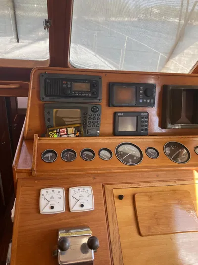 Tatosh Yacht Photos Pics 1998 Grand Banks 43 Eastbay FB helm with navigation instruments and wooden dashboard.