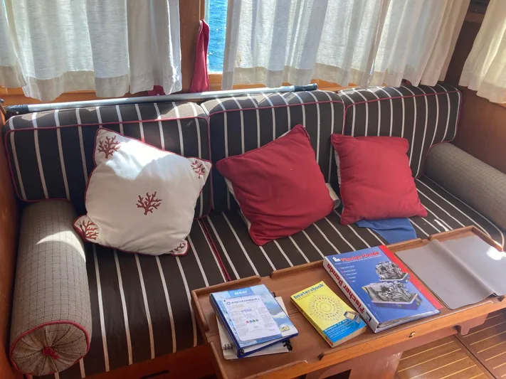 Tatosh Yacht Photos Pics Cozy interior of 1998 Grand Banks 43 Eastbay FB with striped sofa and nautical decor.