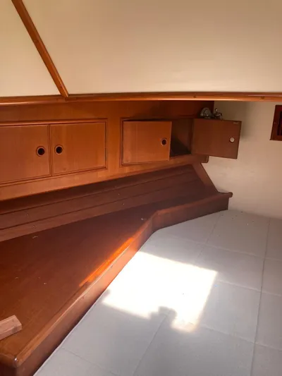 Tatosh Yacht Photos Pics Interior cabin of 1998 Grand Banks 43 Eastbay FB with wooden cabinetry and seating.