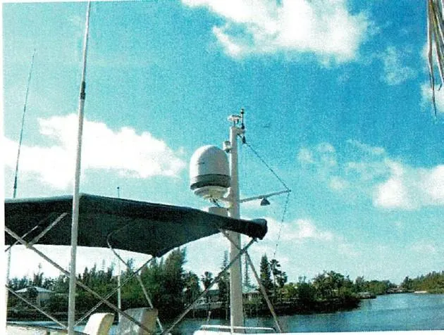 Tatosh Yacht Photos Pics 1998 Grand Banks 43 Eastbay FB yacht with radar, under clear blue sky.
