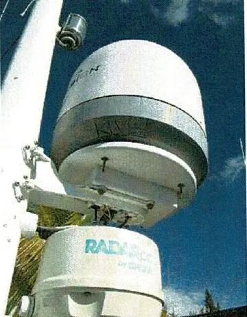 Tatosh Yacht Photos Pics Radar equipment on a 1998 Grand Banks 43 Eastbay FB against a clear blue sky.