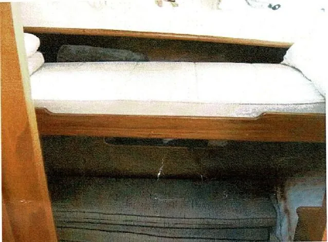 Tatosh Yacht Photos Pics Interior cabin of 1998 Grand Banks 43 Eastbay FB with wooden accents and cushioned seating.