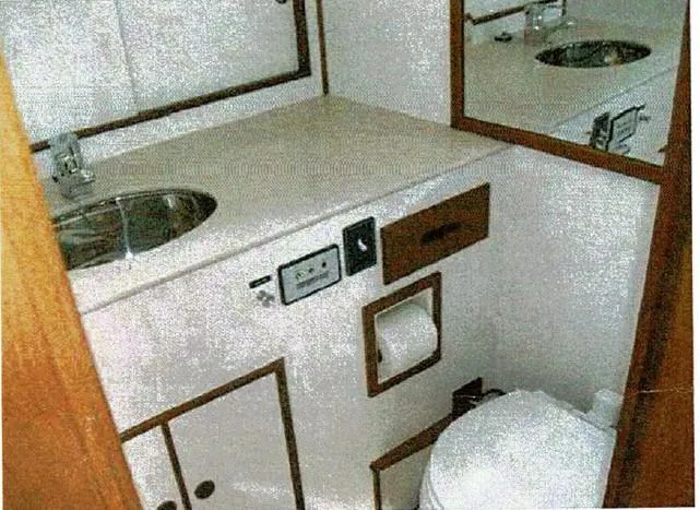 Tatosh Yacht Photos Pics 1998 Grand Banks 43 Eastbay FB bathroom with sink, mirror, and toilet.