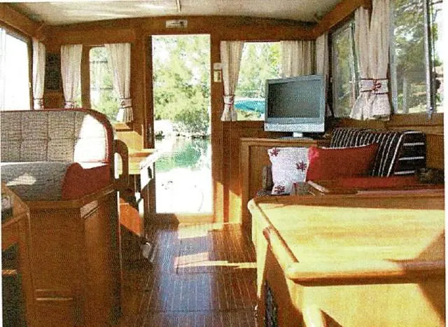 Tatosh Yacht Photos Pics Interior of 1998 Grand Banks 43 Eastbay FB yacht with wood finish and cozy seating.