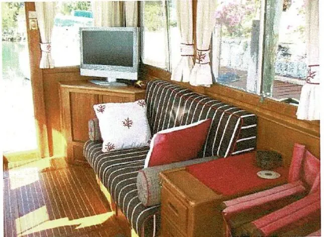 Tatosh Yacht Photos Pics Interior of 1998 Grand Banks 43 Eastbay FB with striped seating and TV.