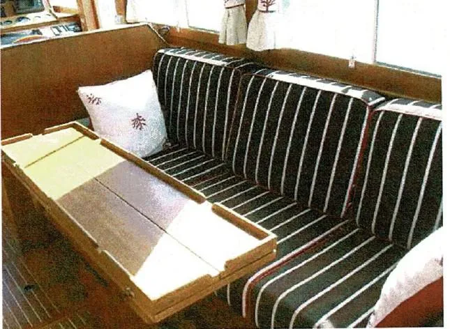 Tatosh Yacht Photos Pics Interior of 1998 Grand Banks 43 Eastbay FB with striped seating and wooden table.