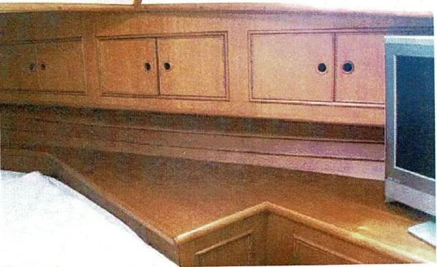 Tatosh Yacht Photos Pics 1998 Grand Banks 43 Eastbay FB interior with wooden cabinetry and a small TV.