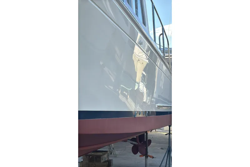 Tatosh Yacht Photos Pics 1998 Grand Banks 43 Eastbay FB yacht hull, docked and polished, with visible propeller.