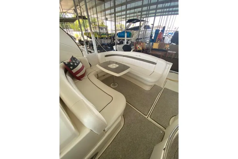  Yacht Photos Pics Luxurious 2006 Sea Ray 40 Sundancer yacht interior with plush seating and table.