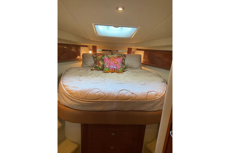  Yacht Photos Pics Luxurious cabin interior of 2006 Sea Ray 40 Sundancer yacht with cozy bedding.