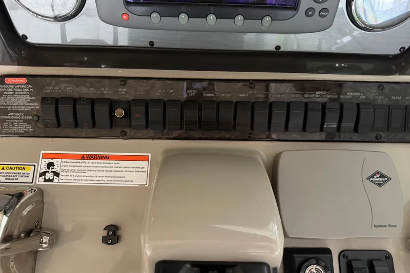  Yacht Photos Pics Control panel of a 2006 Sea Ray 40 Sundancer boat with warning labels.