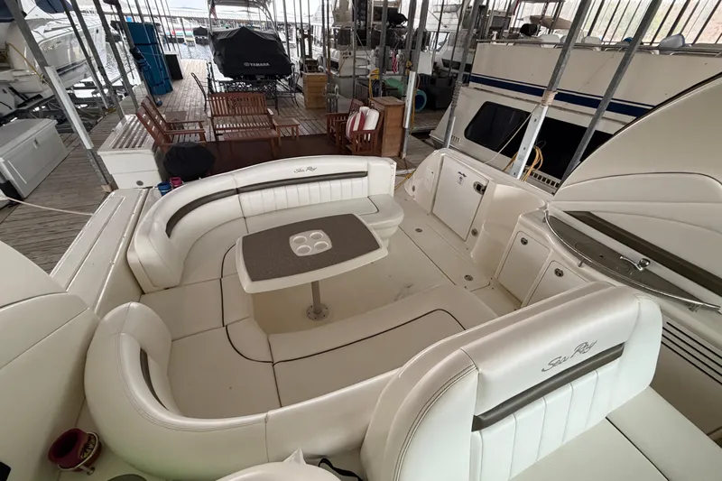 Yacht Photos Pics 2006 Sea Ray 40 Sundancer yacht interior with white seating and table in marina.