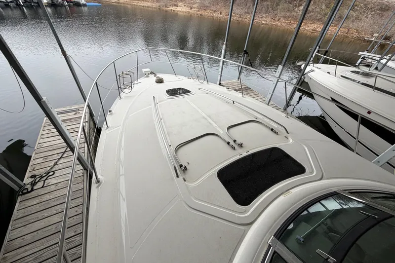  Yacht Photos Pics 2006 Sea Ray 40 Sundancer yacht docked at a marina, viewed from the bow.