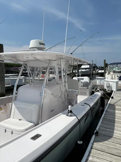  Yacht Photos Pics 2009 Venture 34 CC boat docked at marina under clear blue sky.